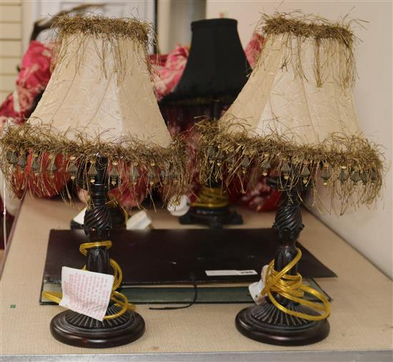 A pair of bronzed metal table lamps, with beige shades overall height 43cm